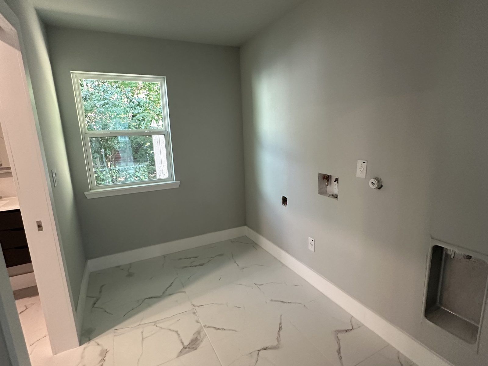 Freshly painted Austin interior with grey walls, white trim and a ceiling fan